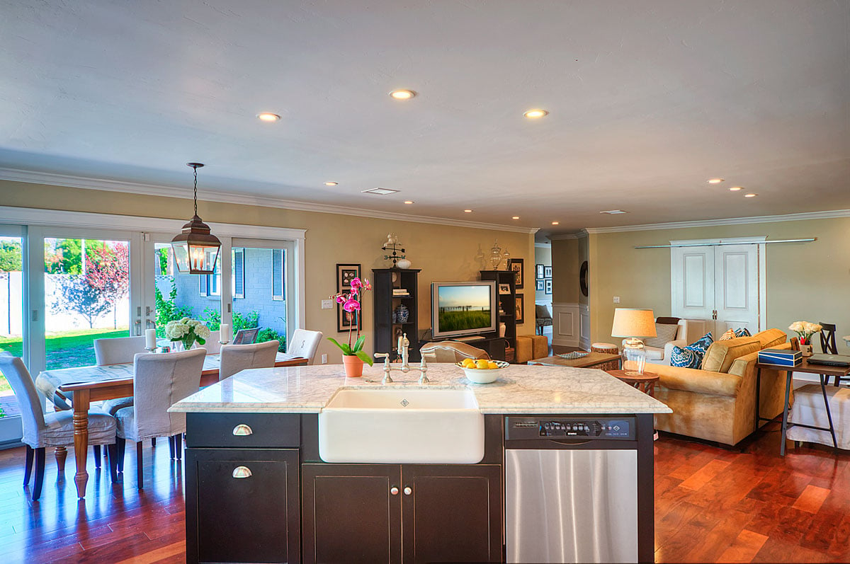 Kitchen with white marble countertop on top of island