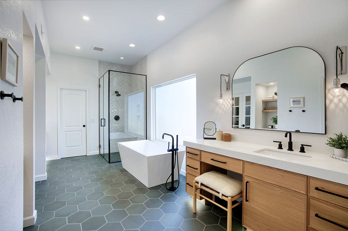 wide angle room view of trendy master bathroom
