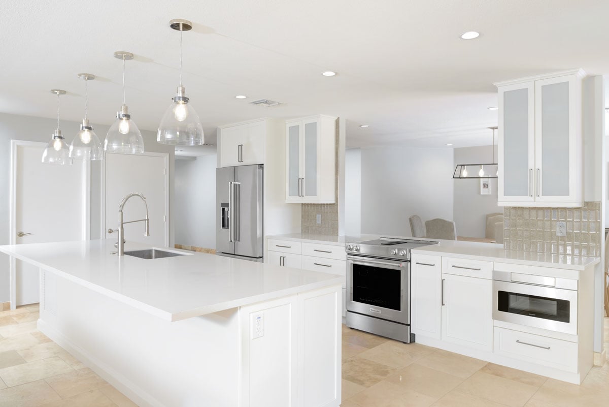 Kitchen featuring white wooden shaker cabinets