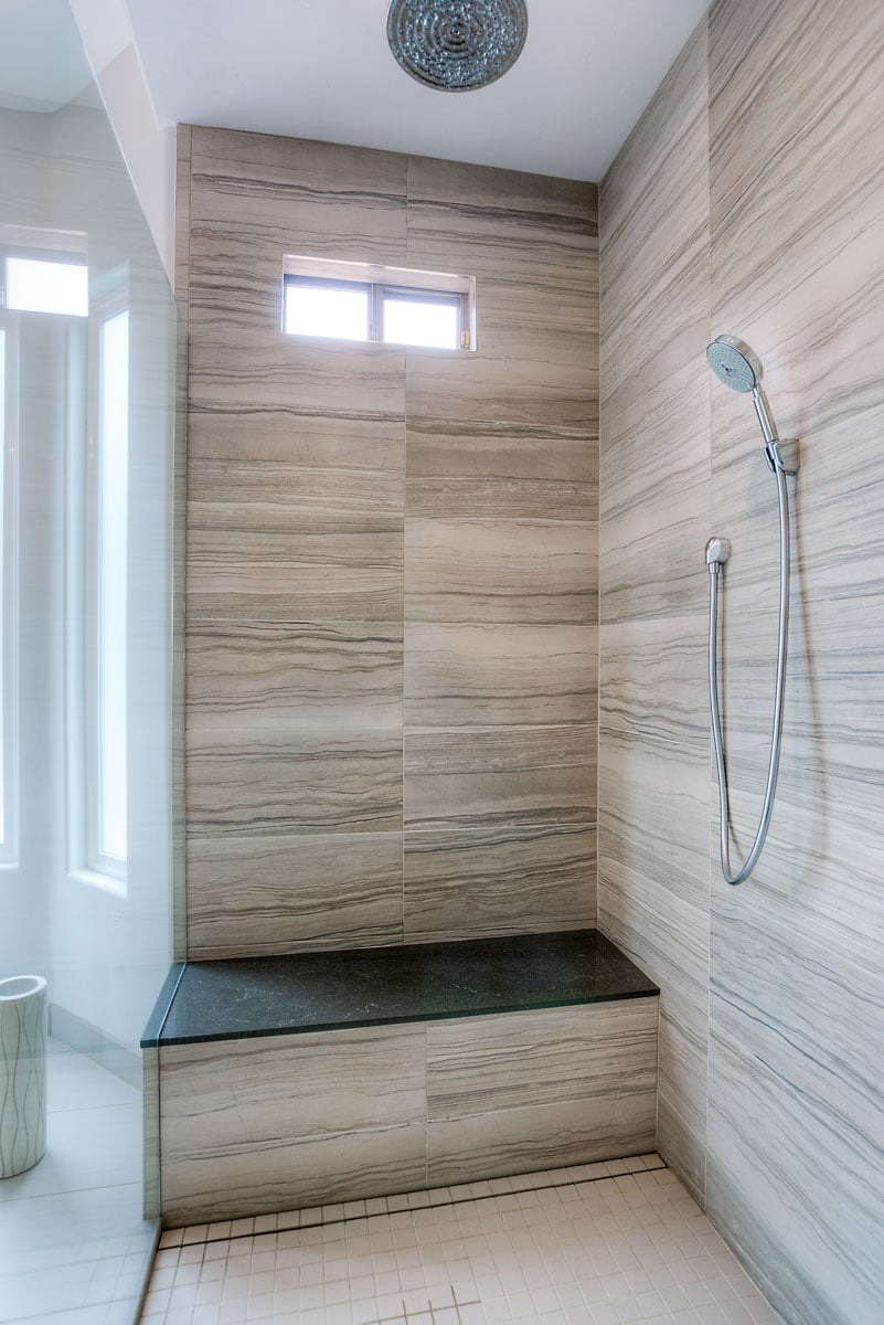 Walk in shower with bench seating area