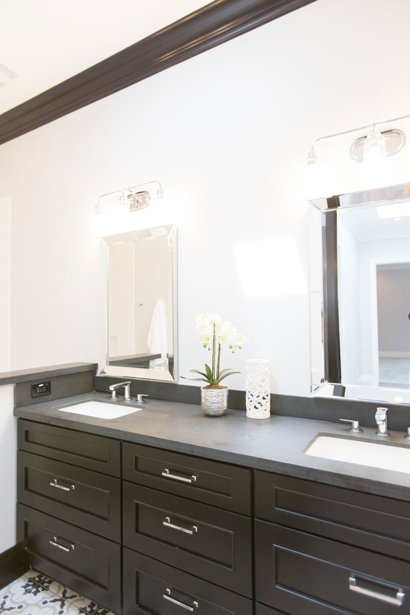 Black cabinetry and double bathroom vanity